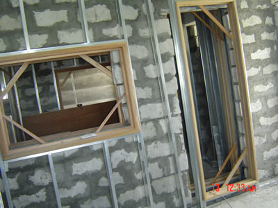 Tracking room under construction. CHB, studs, window and door jambs